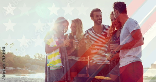 Image of flag of usa over diverse group of friends drinking beer outdoors