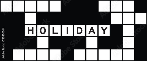 Alphabet letter in word holiday on crossword puzzle background © bankrx