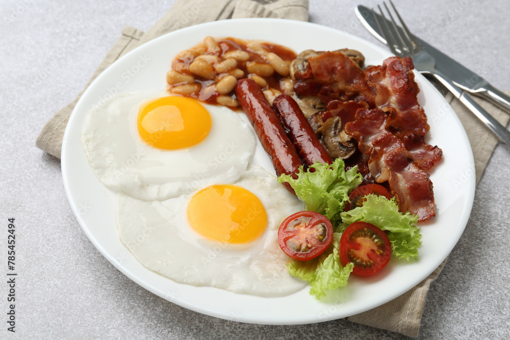 Delicious breakfast with sunny side up eggs on light table, closeup Delicious breakfast with sunny side up eggs on light table, closeup