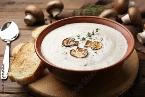 Fresh homemade mushroom soup served on wooden table