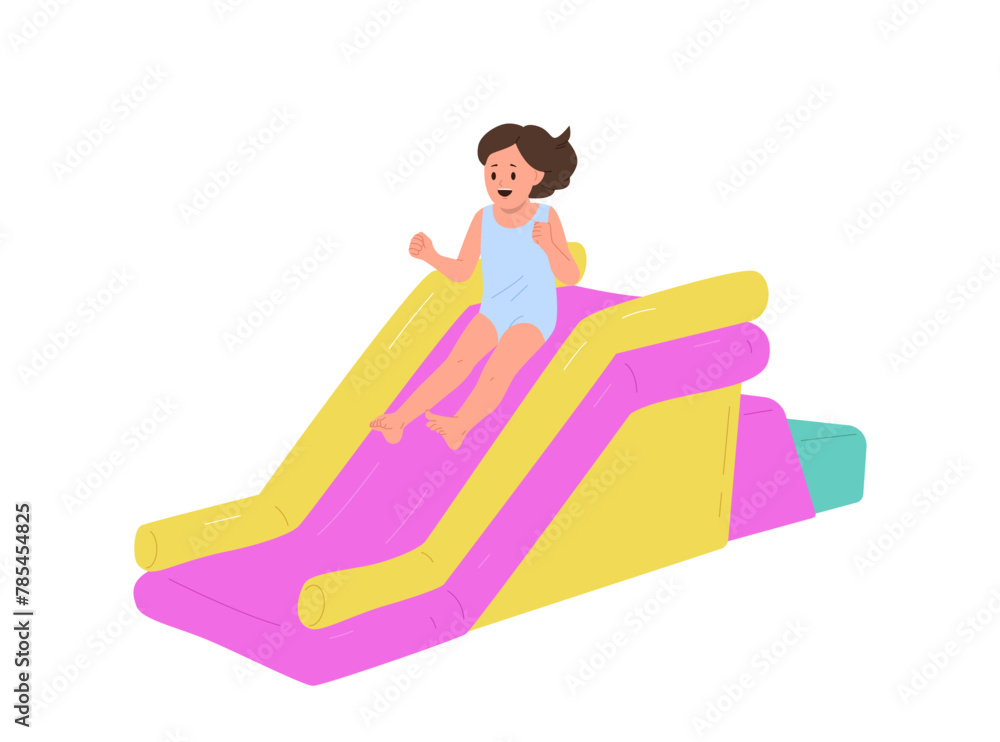 Overjoyed little girl child cartoon character having fun sliding in mini inflatable attraction Overjoyed little girl child cartoon character having fun sliding in mini inflatable attraction
