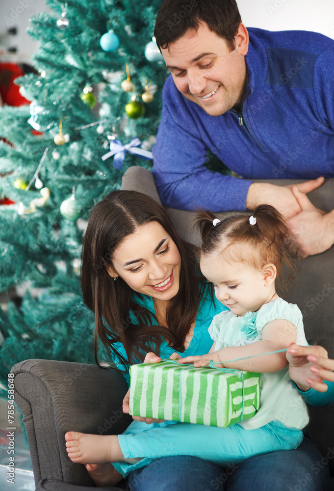 Happy family with Christmas present Happy family with Christmas present