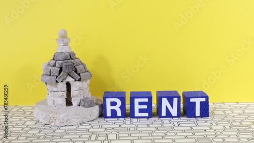 Sign with the words rent, model house - trullo in Puglia Italy - on the table, finance or insurance house concept.
