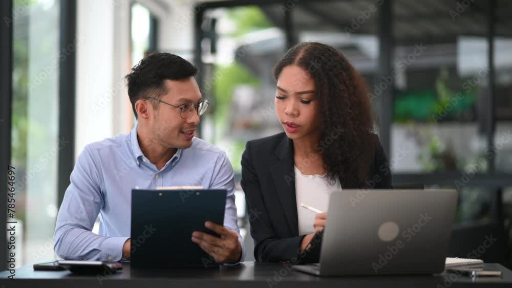 Portrait of success business people working together in modern office. Couple teamwork startup concept Portrait of success business people working together in modern office. Couple teamwork startup concept
