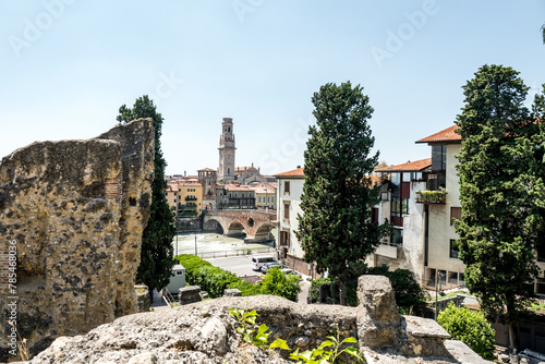 Verona, Italy - August 16 2023: View of Verona city. Colorful residential buildings over Adige river in Verona, Italy