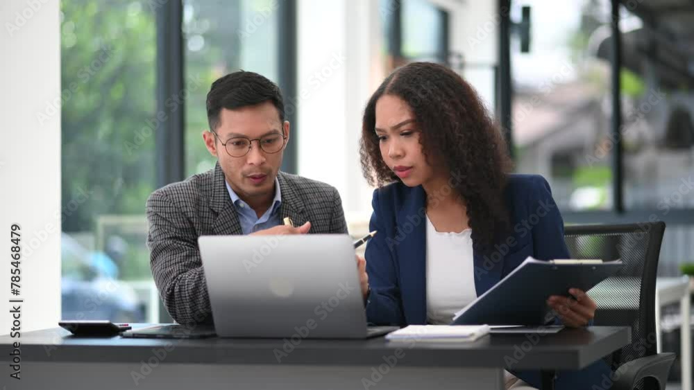 Portrait of success business people working together in modern office. Couple teamwork startup concept Portrait of success business people working together in modern office. Couple teamwork startup concept