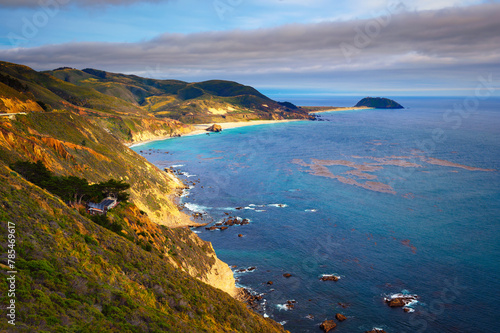 Coastal landscape of Cabrillo Highway in California with Point Sur in the background.