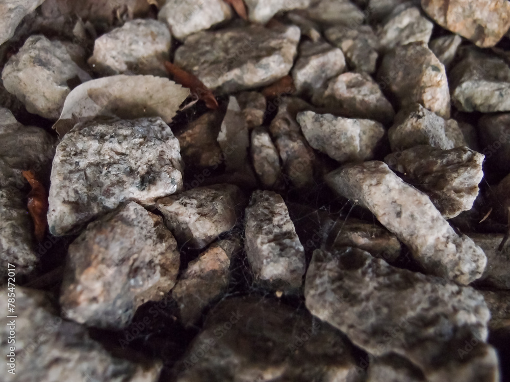 Extreme close-up view of the rocks on the old railway. Different shape of rocks on the railway. Full of rocks. Rock/stone background. Extreme close-up view of the rocks on the old railway. Different shape of rocks on the railway. Full of rocks. Rock/stone background.
