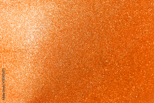 Abstract blurred orange glitter texture background, shiny orange glitter background