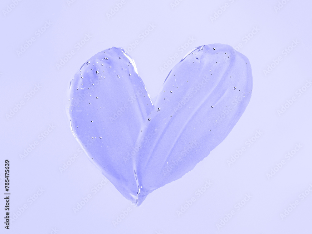 Transparent cosmetic gel heart shape on violet Transparent cosmetic gel heart shape on violet