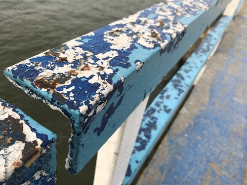 old blue painted fence on the shore