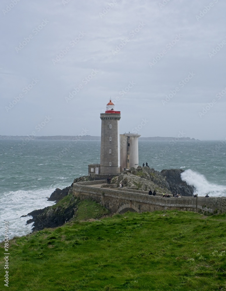Plouzane, France - Apr 6, 2024: The Little Minou Lighthouse (Le Phare du Petit Minou) is a coastal lighthouse located at the west of Brest. Selective focus.