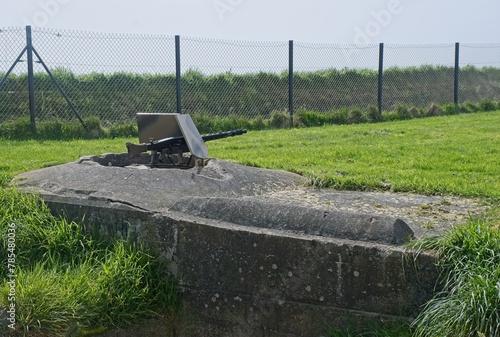 Plougonvelin, France - Apr 7, 2024: MG42 machine gun nest. Graf Spee Battery Fire Control Post during the Second World War. Sunny spring day. Selective focus. photo