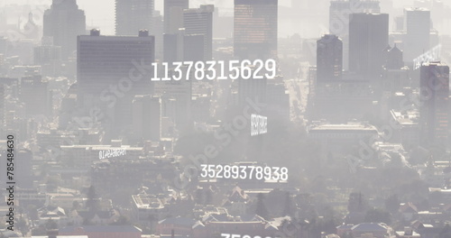 Image of numbers and data processing over cityscape