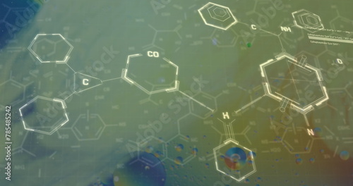 Image of chemical formula over bubbles on yellow background
