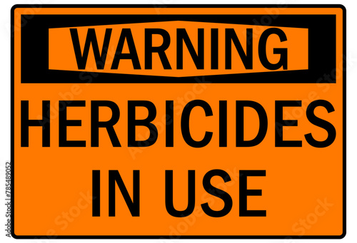 Farm safety sign herbicide in use