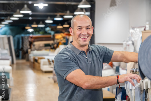 A mattress salesman in his shop