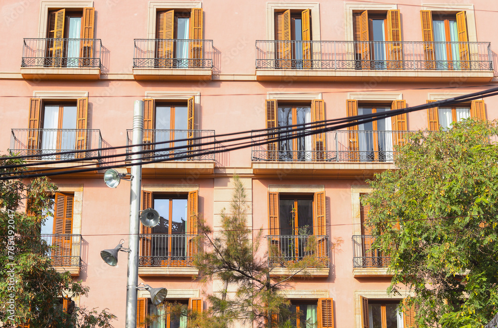 Exterior facade of historical house with apartments in Barcelona, Spain. Urban vintage background. The building with carved balconies. Exterior facade of historical house with apartments in Barcelona, Spain. Urban vintage background. The building with carved balconies.