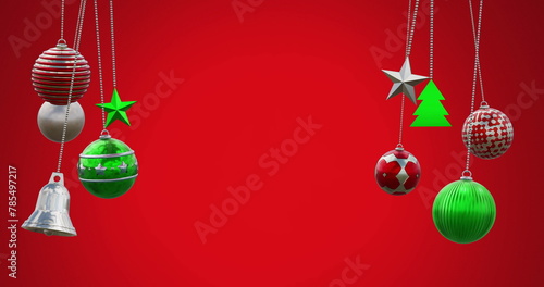 Image of hanging baubles, tress, bell swinging against red background