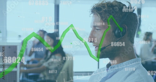 Image of green line and data processing over caucasian businessman in office photo