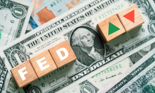 FED wording with green up and red down arrow on USD one dollar banknote for Federal bank reserve increase and decrease interest rate control which effect to America and world economic growth concept.