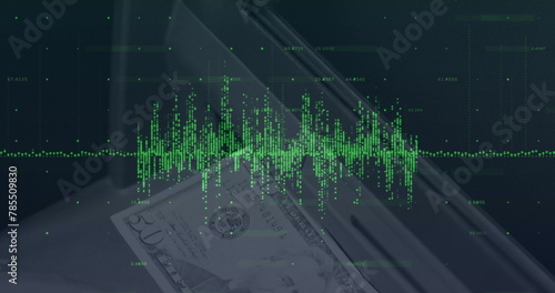 Image of financial data processing over banknote on desk