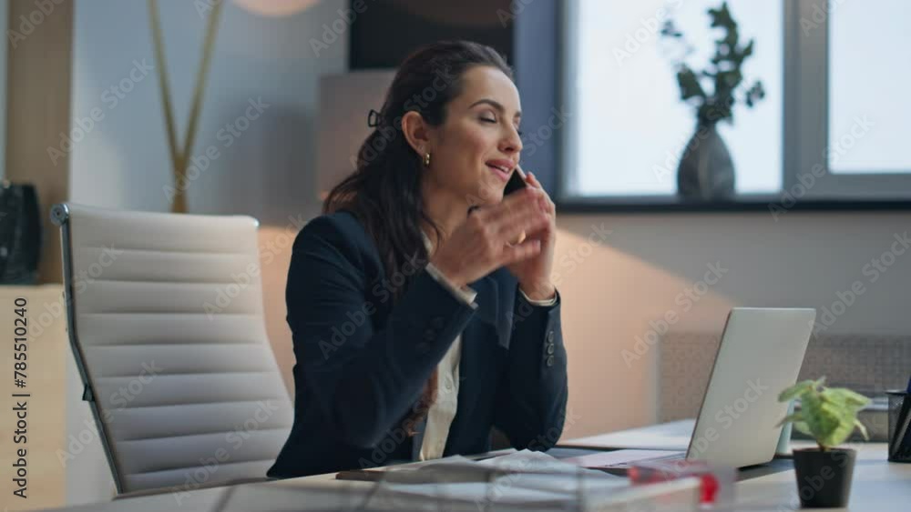 Smiling executive speaking mobile phone in modern office. Joyful woman call Smiling executive speaking mobile phone in modern office. Joyful woman call