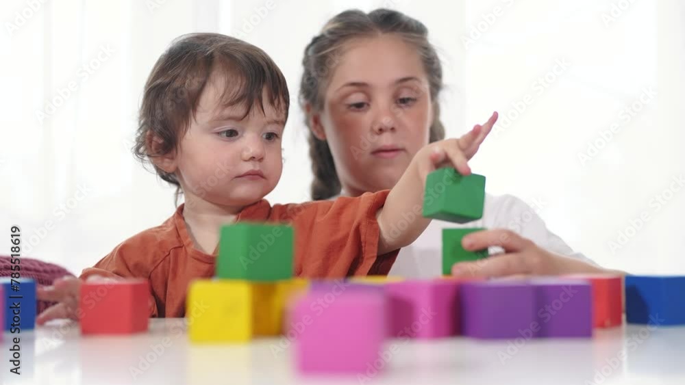 child baby group playing cubes close-up. education a children development of fine motor skills concept. child baby group close-up hands lifestyle plays with blocks develops fine motor skills child baby group playing cubes close-up. education a children development of fine motor skills concept. child baby group close-up hands lifestyle plays with blocks develops fine motor skills
