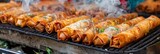Crispy vegetable spring rolls frying to golden perfection in deep fryer, delicious and crunchy