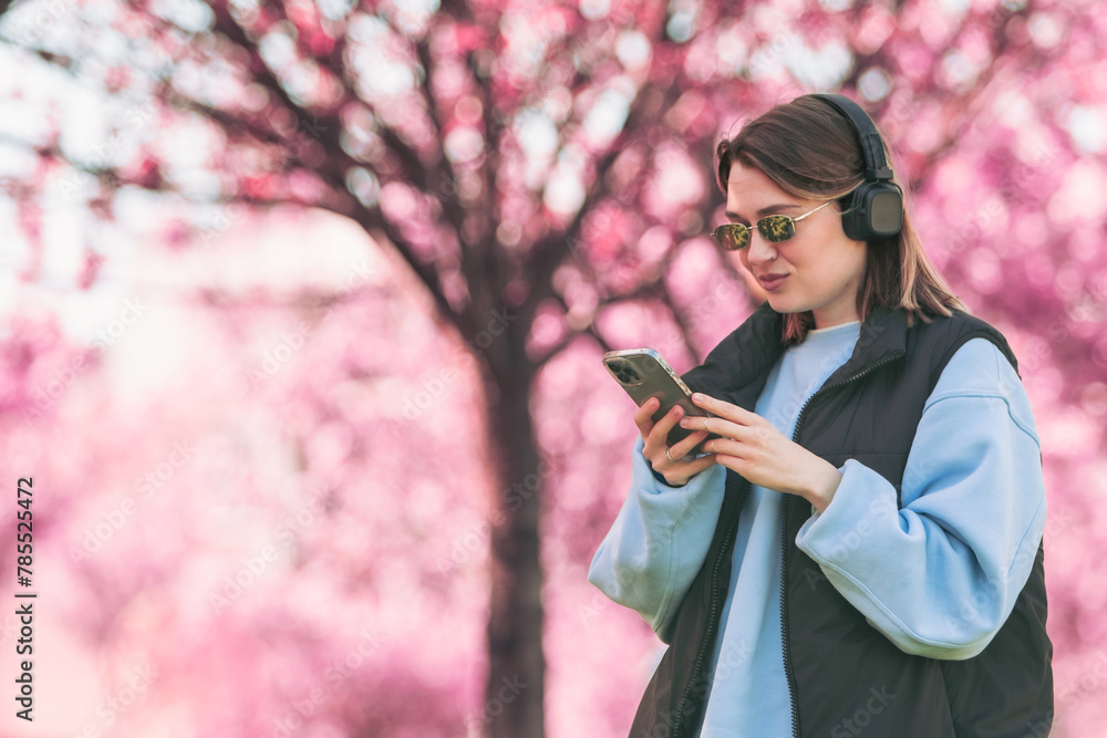 woman music lover checking songs on her phone