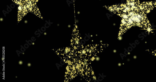 Image of dots over golden stars on black background