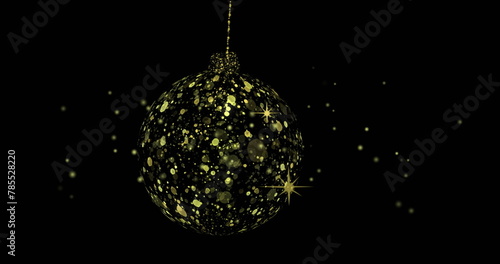 Image of dots over golden bauble on black background