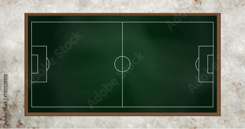 Image of game plan on green board over grey background