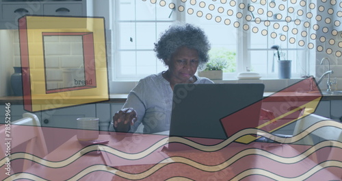 Image of shapes over senior african american woman using laptop