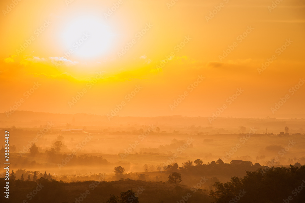 Fantastic scene of sunrise with sun on left in Pak Chong, famous attraction in Nakhon Ratchasima Province, Northeast of Thailand Fantastic scene of sunrise with sun on left in Pak Chong, famous attraction in Nakhon Ratchasima Province, Northeast of Thailand