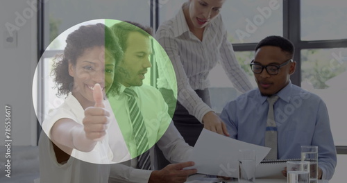Image of loading pie chart over diverse coworkers sharing ideas and woman showing thumbs up