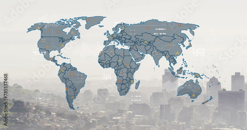 Image of world map and financial data processing over cityscape