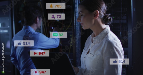 Image of notification bars over diverse engineers checking data server system using laptop