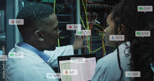 Image of notification bars over african american engineers discussing about data server system