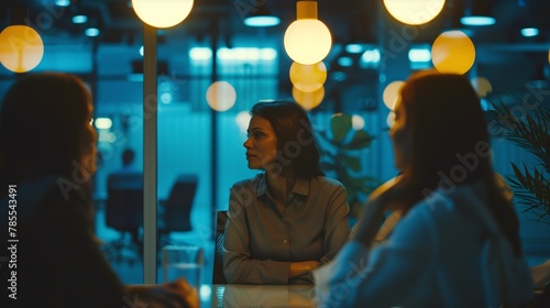 Women in discussion during a business meeting in a bright office