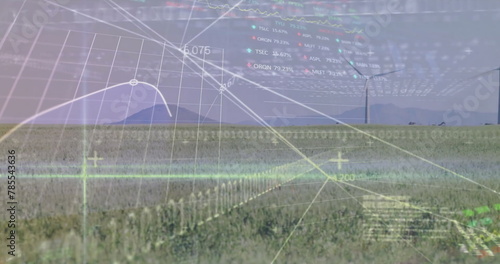 Image of stock market and data processing over field with wind turbines