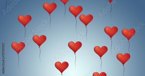 Digital image of multiple red heart shaped balloons floating against blue background