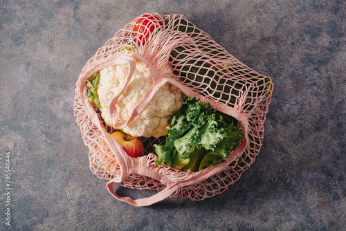 fruits vegetables in reusable mesh cotton bag, plastic free zero waste concept