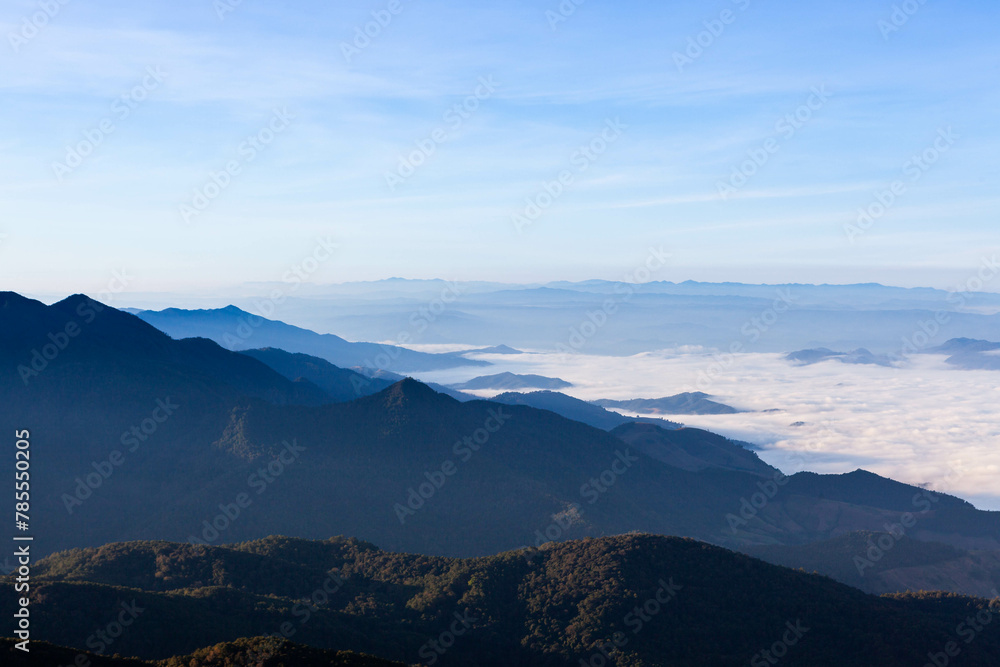 Fototapeta premium North Thailand mountain landscape. View from Doi Inthanon mountain. Mountains and cloud sea. Early morning and the sea of mist.