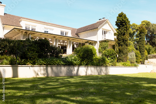 A large house with spacious lawn and greenery at home