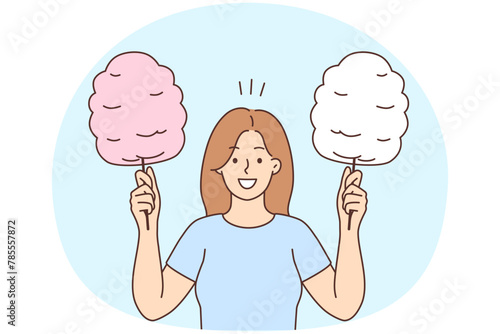 Smiling woman holding cotton candy