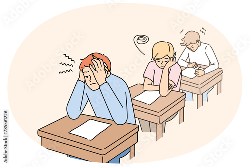 Anxious students sitting at desk in classroom writing test together. Worried pupils finish examination in classroom. Education and exam time. Vector illustration.