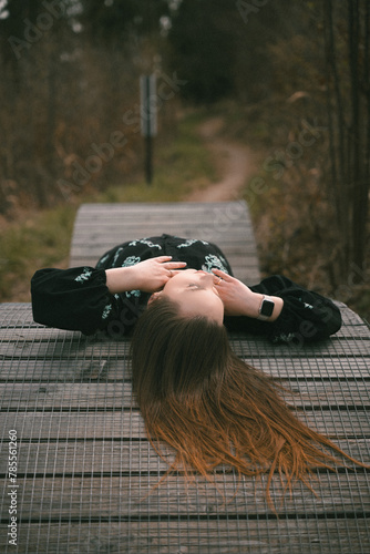 girl lying on the road for bicycles