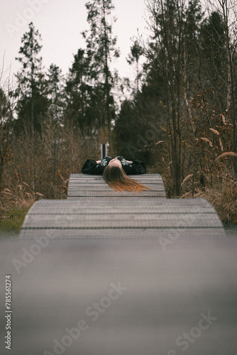 girl lying on the road for bicycles