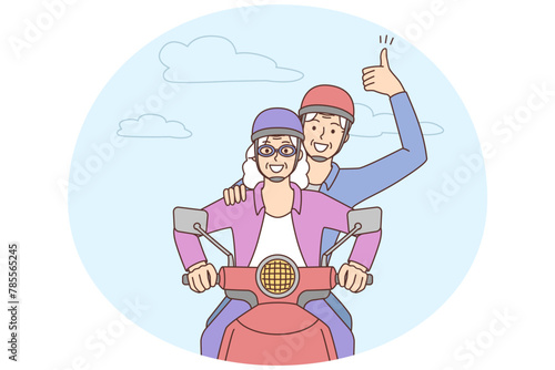 Smiling mature couple driving motorbike